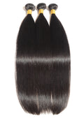 Three bundles of straight black hair extensions on a white background