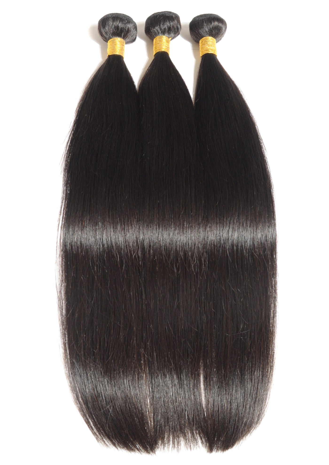 Three bundles of straight black hair extensions on a white background